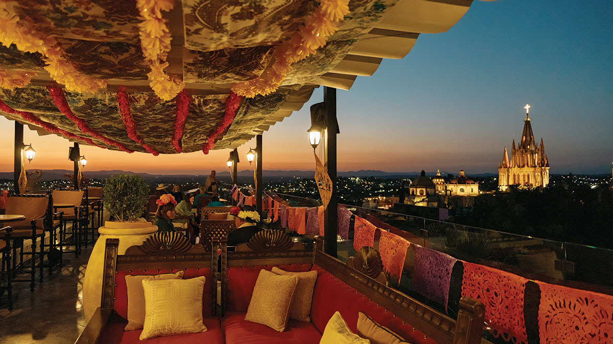 A golden-hour rooftop view over a city skyline